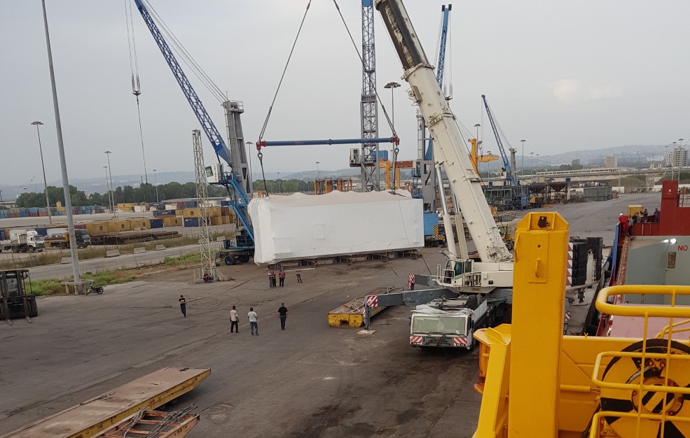 argo being transported from warehouse to shipping vessel by Bitar Maritime