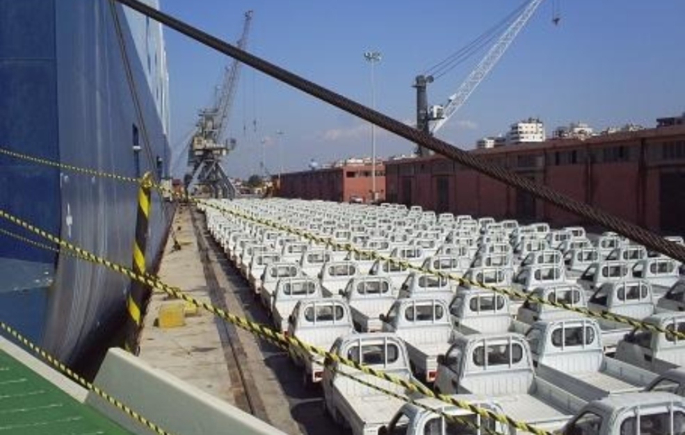 Multiple cargo trucks lined up at the port for loading and unloading