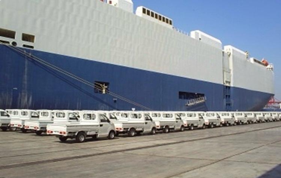 Shipping port with several transport trucks preparing cargo delivery